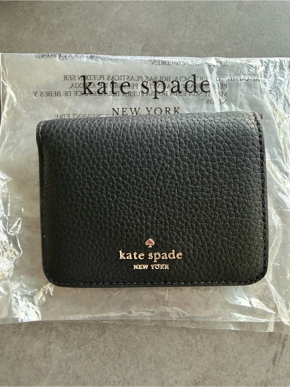 kate spade Black Pebbled Leather Bifold Wallet with Gold Logo